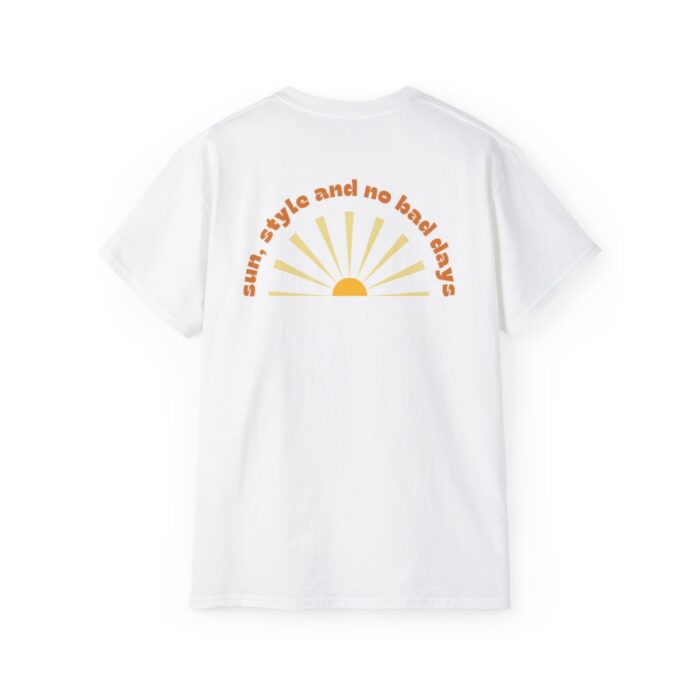 White T-shirt featuring 'No Bad Days Club' logo above a vibrant beach scene with palm trees and waves, displayed on a plain background.