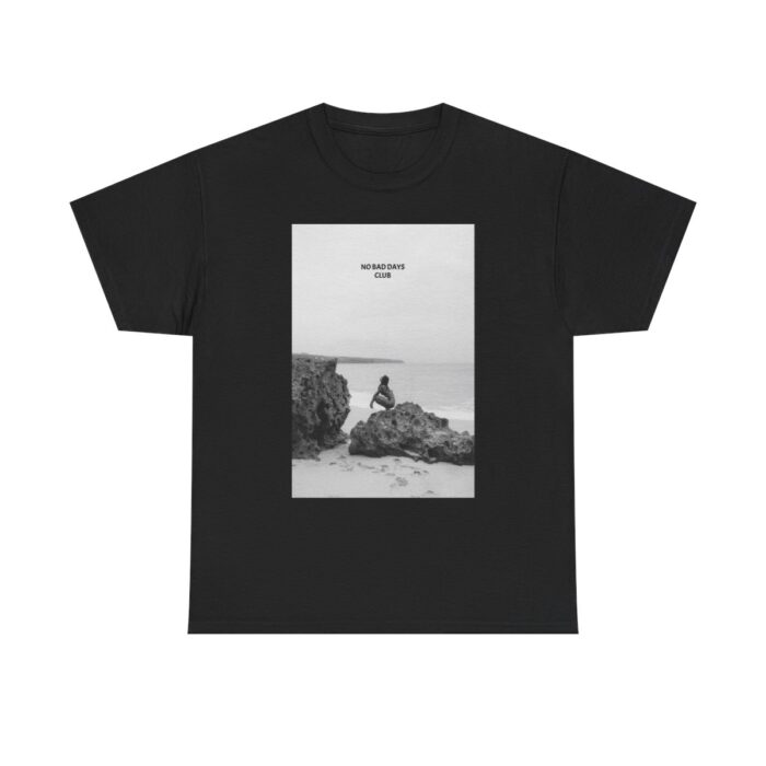 Black T-shirt with 'No Bad Days Club' logo and a colorful sunset over the ocean graphic, displayed on a plain background.